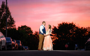 Couple at their backyard Harrisonburg wedding at night in the street